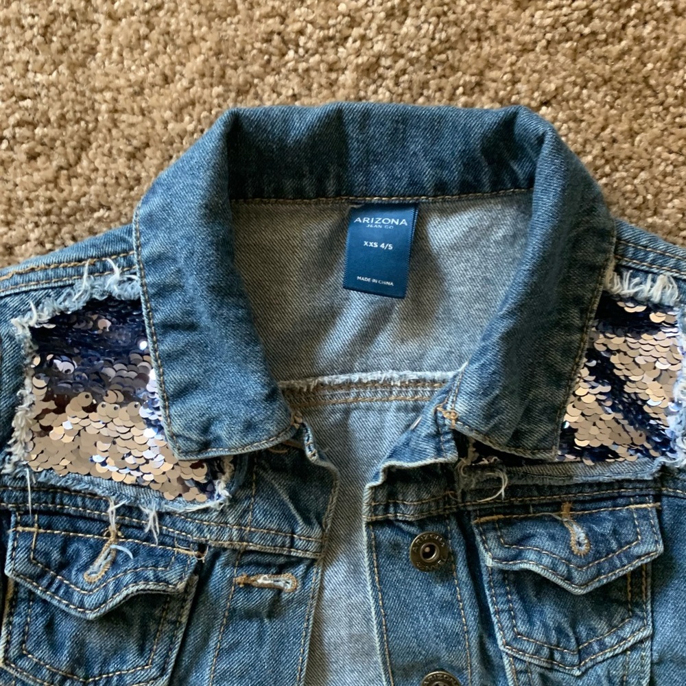 This beautiful blue Jean jacket sparkles